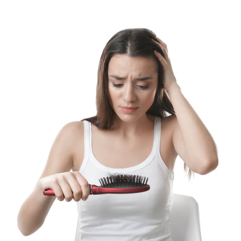 Worried girl looking at fallen hair at comb