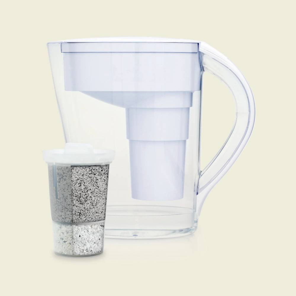 Water filter pitcher with a removable filter cartridge on a light background.